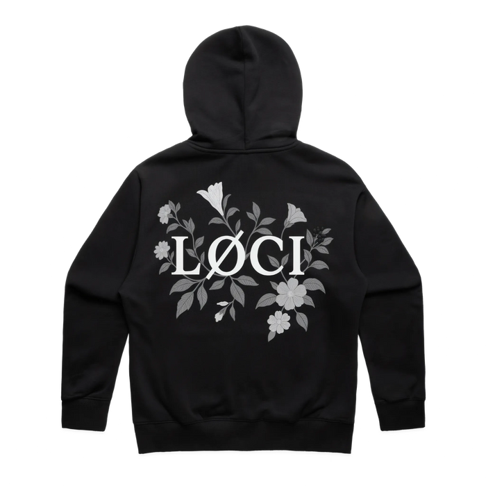 Black hoodie with floral design and 'Löci' logo on the back against a white background