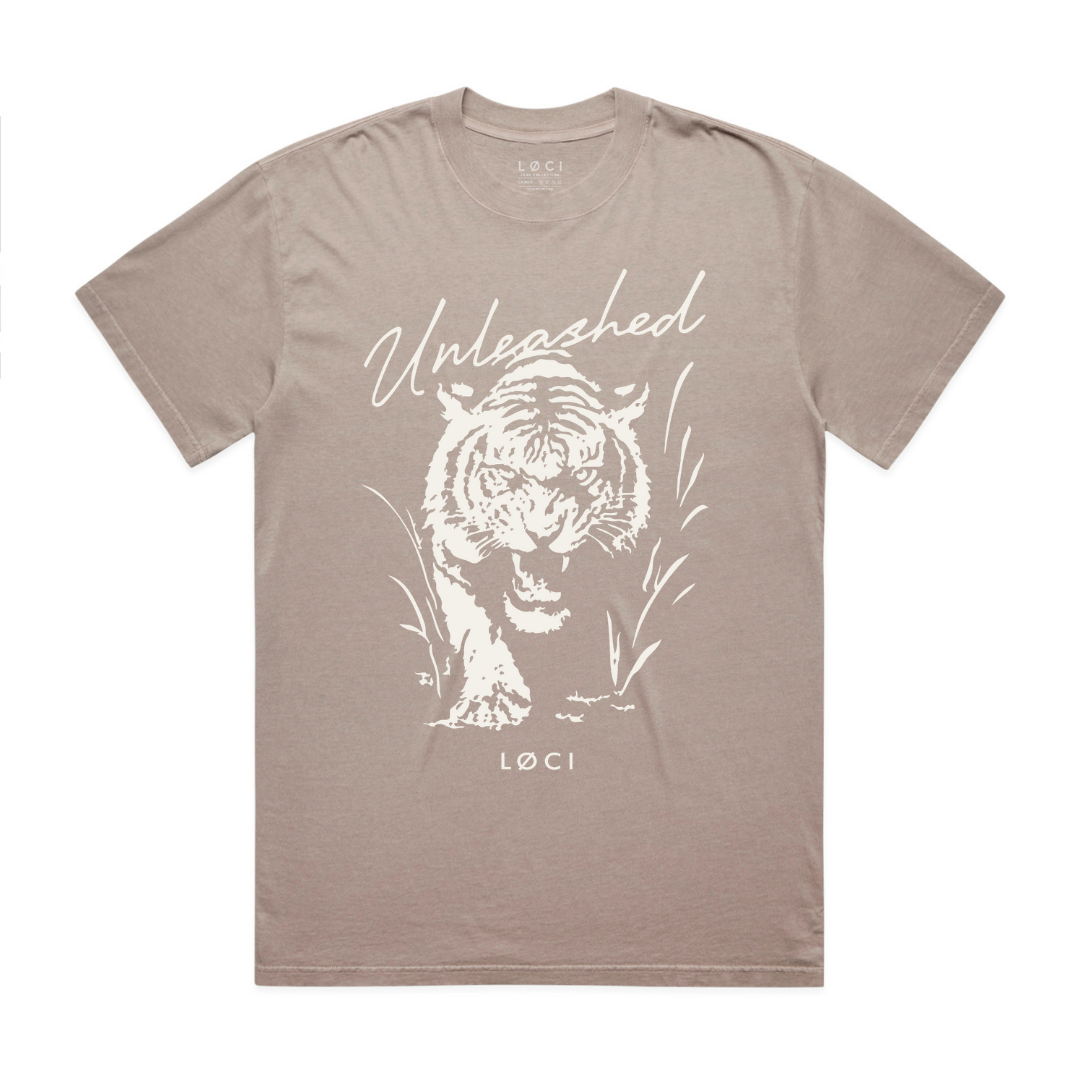 Brown t-shirt with white tiger graphic and 'Unleashed' text on a white background